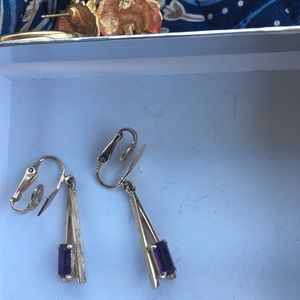 Vintage Avon gold dangle earrings with a purple stone